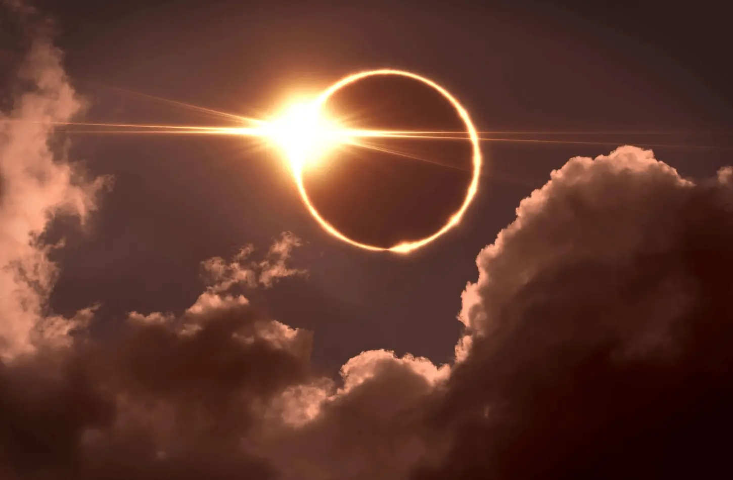 A dramatic view of a solar eclipse showing a ring of fire effect through clouds in the Egyptian sky.