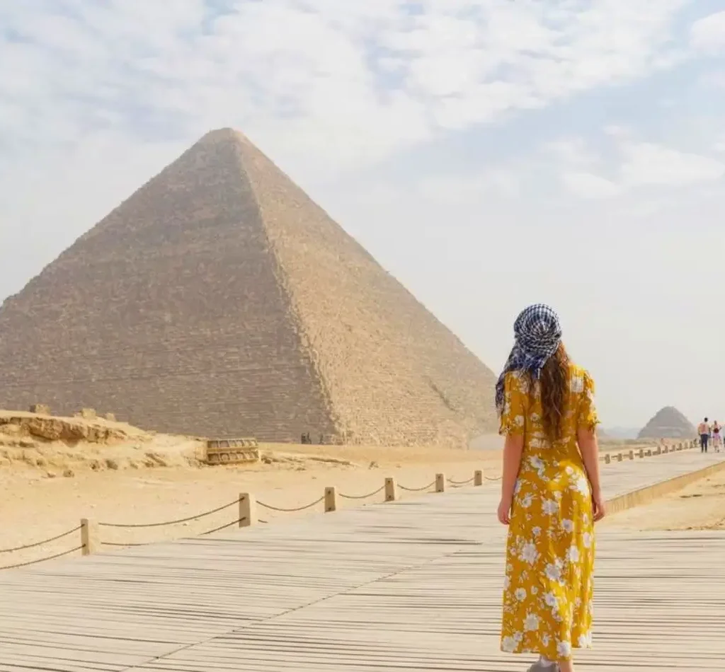 Woman walking toward Khafre Pyramid during a Pyramids of Giza tour with Egyptologist