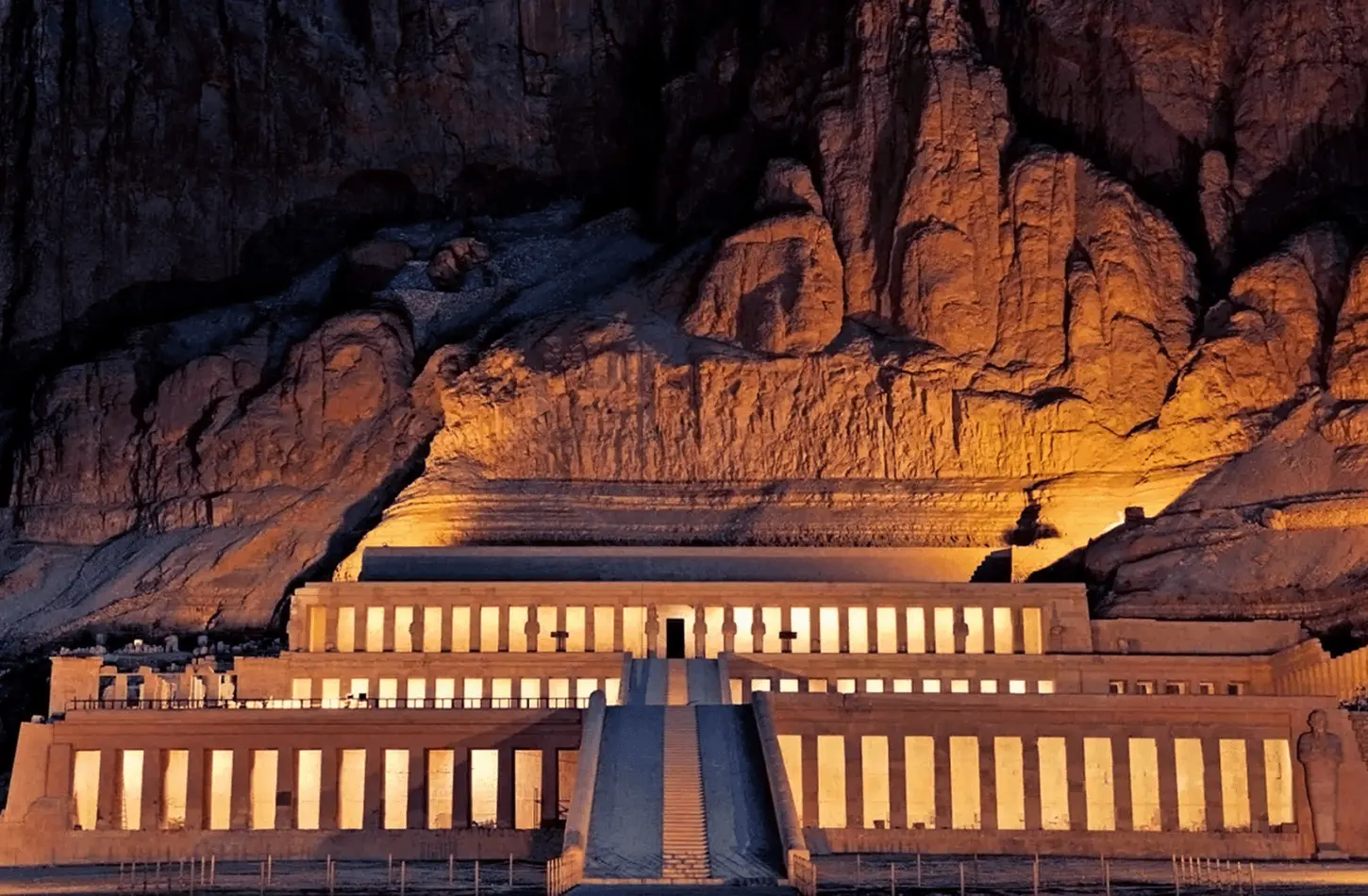 The illuminated terraces of Hatshepsut Temple in Luxor at night, featured in the best Egypt tour packages.