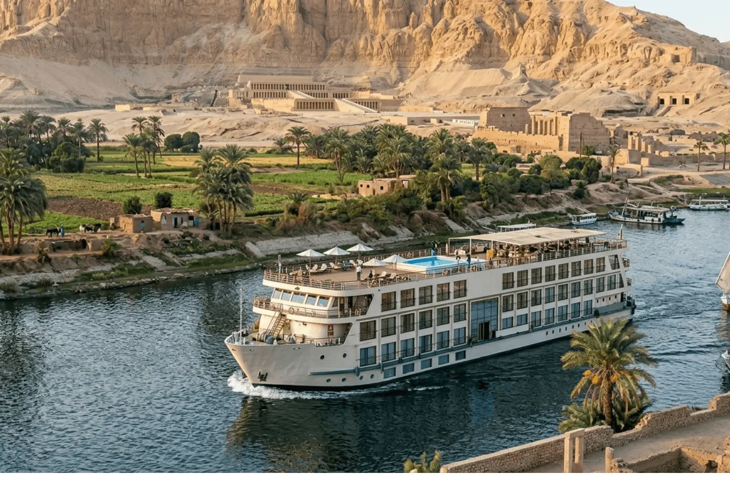 A luxury Nile River cruise ship sailing past lush riverbanks with the Temple of Hatshepsut in the background, a premier highlight of the best Nile river cruises.