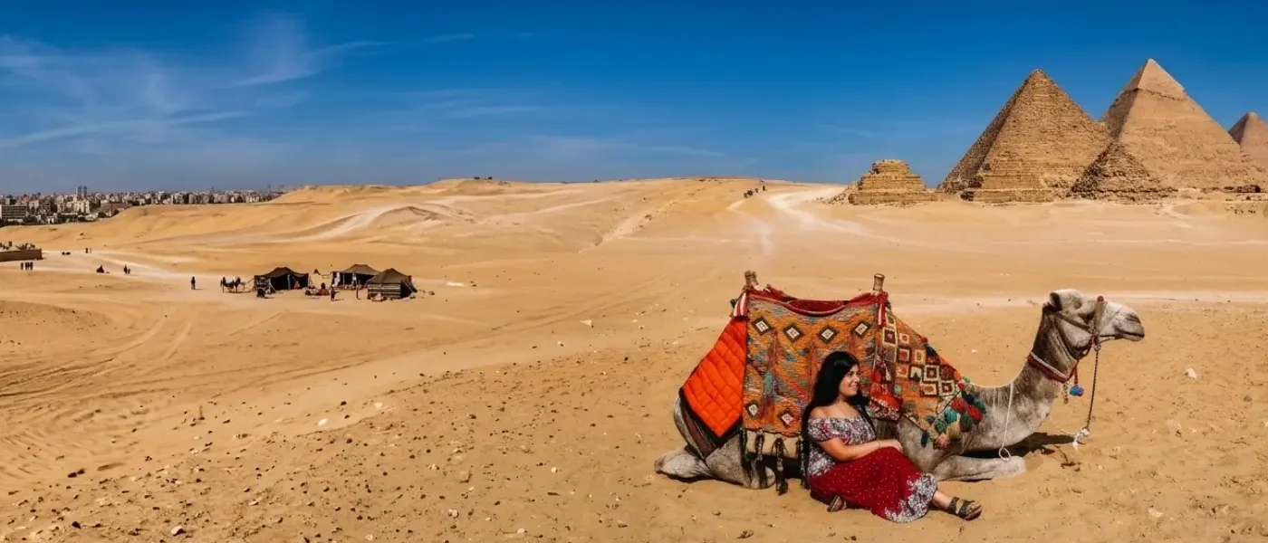 A tourist looking out across the desert at the Great Pyramids of Giza as a camel and horse caravan passes by during a vacation to Egypt in September.